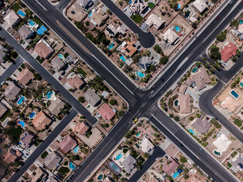 Top down drone shot of desert landscape residential cul-de-sacs and pools