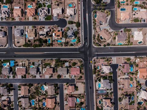 Top down drone shot of desert landscape residential cul-de-sacs and pools