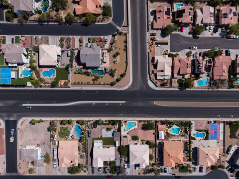 Top down drone shot of desert landscape residential cul-de-sacs and pools