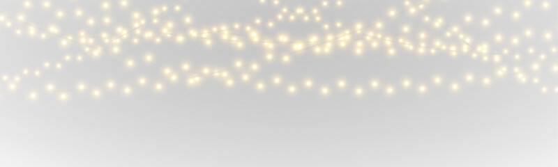 Obraz premium Warm golden lights create festive charm. PNG transparent design element for celebrations. Delicate sparkle enhances holiday spirit.
