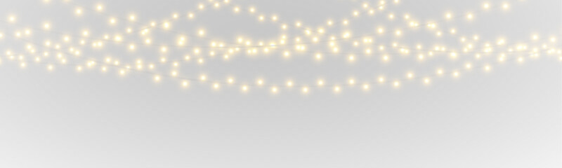 Obraz premium Bright decorative lights form a border. PNG transparent festive asset for layouts. Warm glow enriches holiday designs.