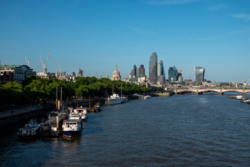 Fototapeta premium London, UK, 27th May 2026 - London Skyline from Waterloo bridge showing building work in progress and the main financial district, late evening suchine,mid shot