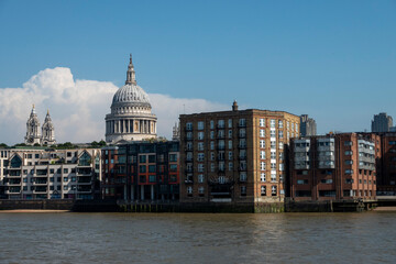 Obraz premium London, UK, 27th May 2026 - St Paul's Cathedral seen from across the river with modern residential buildings in foreground. London Skyline
