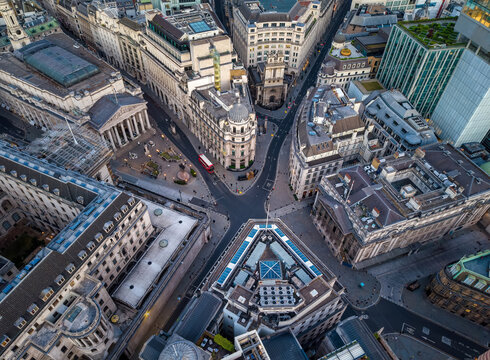 Aerial overhead view of the City of London skyline with Bank station square and Cornhill during sunset