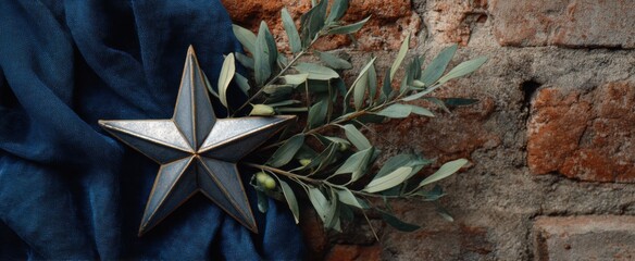 Obraz premium Shiny star adorned with olive leaves and blue cloth on a vintage brick backdrop symbolizing religious festival observance