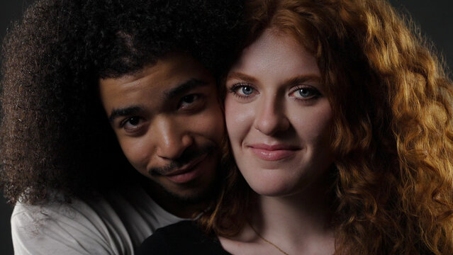 Diverse young couple embracing, representing togetherness and connection