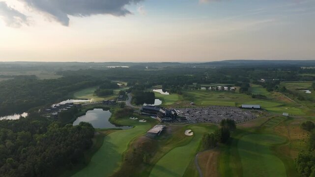 TPC Osprey Valley Golf Course, highlighting the lush fairways and dramatic cloud formations. Ideal for landscape and golf-themed projects.