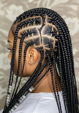 Black Woman's Intricate Braided Hairstyle with Beads