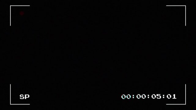 A recording display shows time elapsed while capturing video footage in a professional setting with a focused emphasis on the recording process