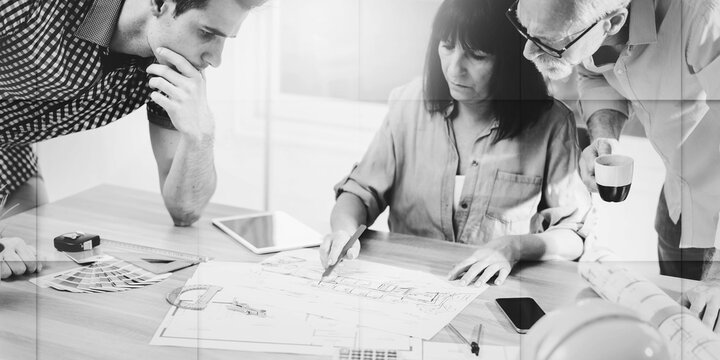 Architects working on plans, light effect, geometric pattern