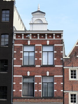 Amsterdam Canal Brick House Facade with White Decoration Close Up, Netherlands