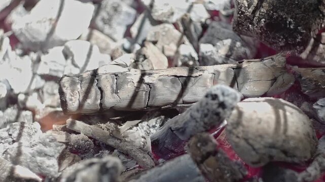 Atmospheric close up footage of burning charcoal embers