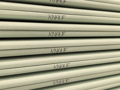 Stack of Green Water Resistant Knauf Drywall Sheets