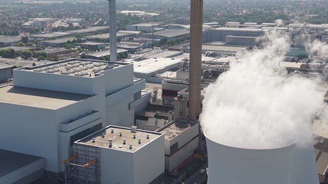 Multifuel Waste Power Station Emitting Steam During Daytime