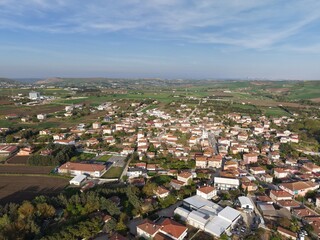 Obraz premium Peaceful Countryside Village Under Endless Blue Skies