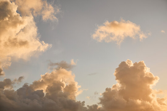 Puffy Cumulus clouds at sunrise