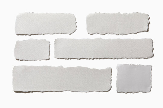 Pieces of torn paper on white background