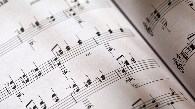 Closeup-of sheet music in dappled light