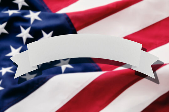Blank banner in front of American flag
