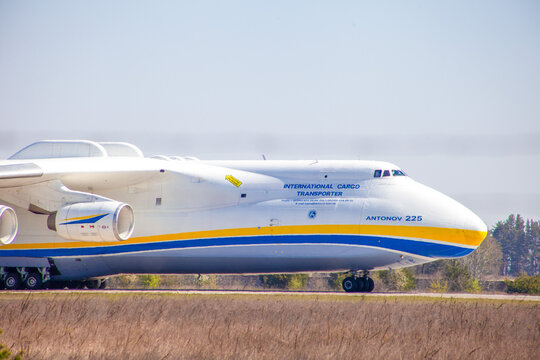 Plane Antonov AN-225 Mriya biggest airplane in the world. UR-82060 aircraft Air cargo land strip landing gear wheels. Hostomel, Ukraine - April 23, 2020.