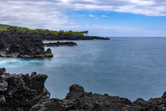 Motion blur ocean and rocky coastline