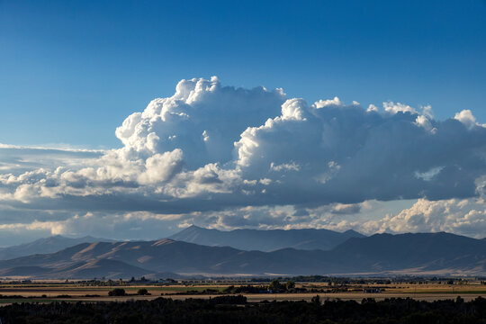 White puffy clouds over mountains