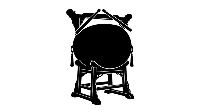 Black drum with drumsticks on stand.