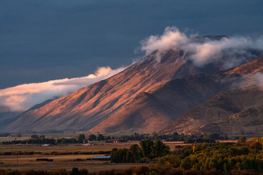 Clouds covering hills in late afternoon light