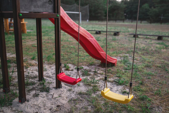 Children's playground, swings, and outdoor sports area