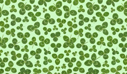 Fototapeta premium Symmetric three leaf clover pattern on light green background luck and nature concept