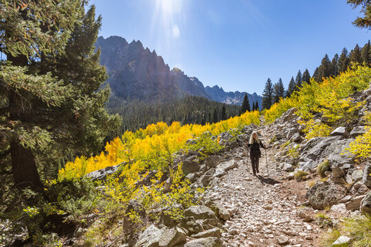 Senior woman hiking in Sawtooth Mountains on sunny day