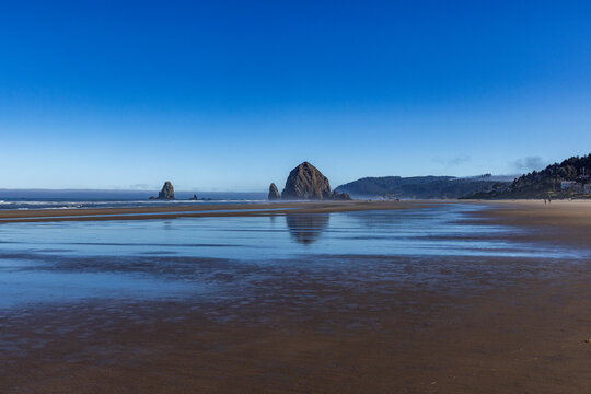 Cannon Beach at low tide with Haystack Rock in background