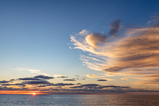 Clouds above ocean at sunset