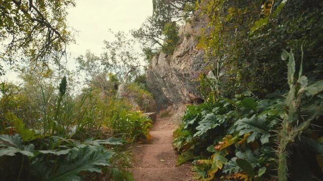 Personal perspective walking on a narrow mountain path