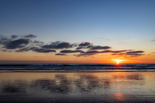 Sun setting over calm ocean