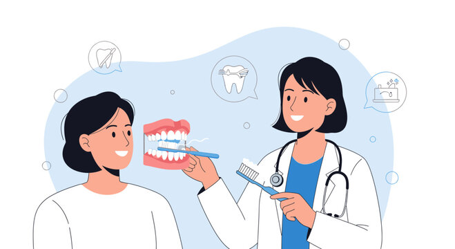 Dentist teaching patient dental hygiene with toothbrush and teeth model