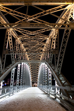 The first arch bridge built in Russia&mdash;the Belelyubsky Bridge&mdash;features architectural and artistic nighttime illumination. Borovichi, Novgorod Oblast, Russia.