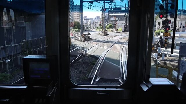 train driver view through front window on curved railway tracks
