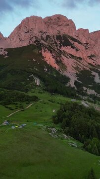 Aerial view of Mount Maglic, the highest point in Bosnia and Herzegovina, and a mountain camp against the backdrop of a beautiful sunset