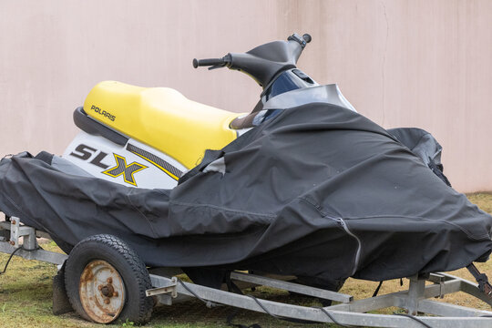 Polaris slx jet ski covered on trailer for storage
