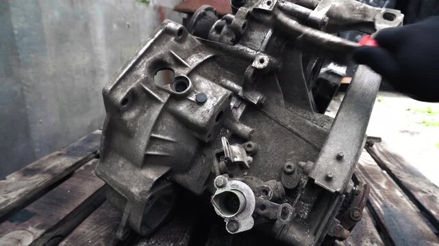 manual transmission from an old car removed for cleaning and washing, repair and replacement of oil seals
