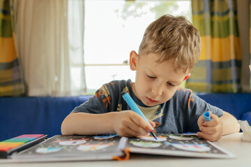 Preschooler doing exercises in a camper van in summer.  © belyaaa
