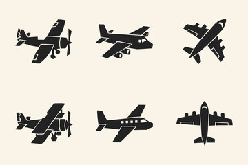 Set of six black airplane silhouette icons including propeller planes and commercial jets © thetwelvesense