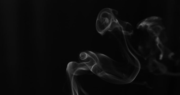 Detailed slow motion rising smoke isolated on black background. Cinematic fog overlay with soft swirling motion, ideal for VFX compositing, transitions and atmosphere.