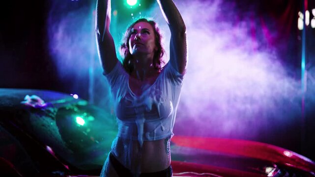 Woman Posing Beside Car Under Neon Haze Lighting