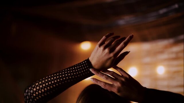 Artistic Close Up of Hands in Fishnet Gloves