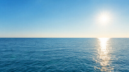 Obraz premium Blue Ocean Panorama With Sunlight Reflections. Beautiful Ocean Surface With Rippled Waves