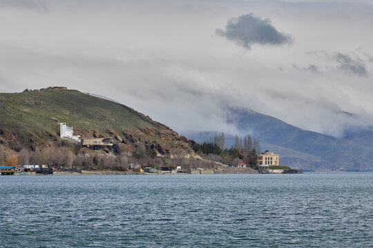 Armenian Highland Vista: Lake Sevan, Sloping Terrain, and Soft Atmosphere