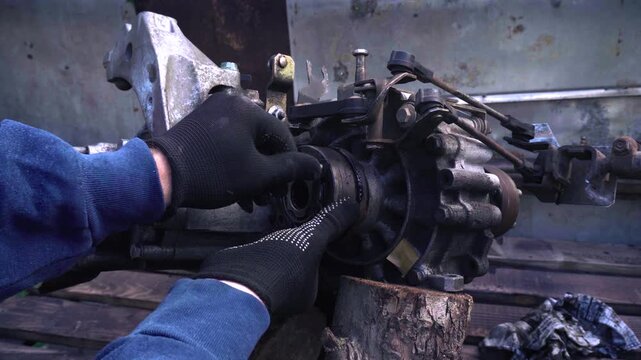 manual transmission from an old car removed for cleaning and washing, repair and replacement of oil seals