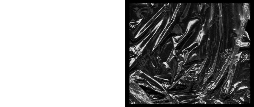 Crumpled plastic wrap texture on black background, wrinkled transparent cellophane film overlay, shiny distorted polyethylene material for design
